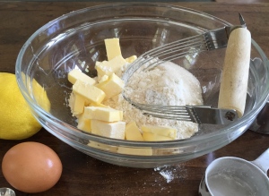 Using a pastry blender cut butter into the flour mixture.  You can also use a food processor for this step.