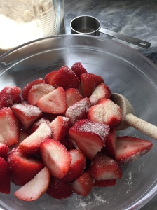 Toss the strawberries and sugar together.  Leave for 30 minutes, stirring occasionally.