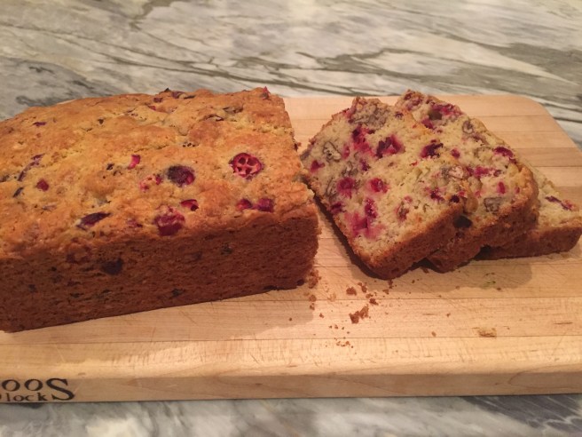 Cranberry Nut Bread- sliced on a cutting board
