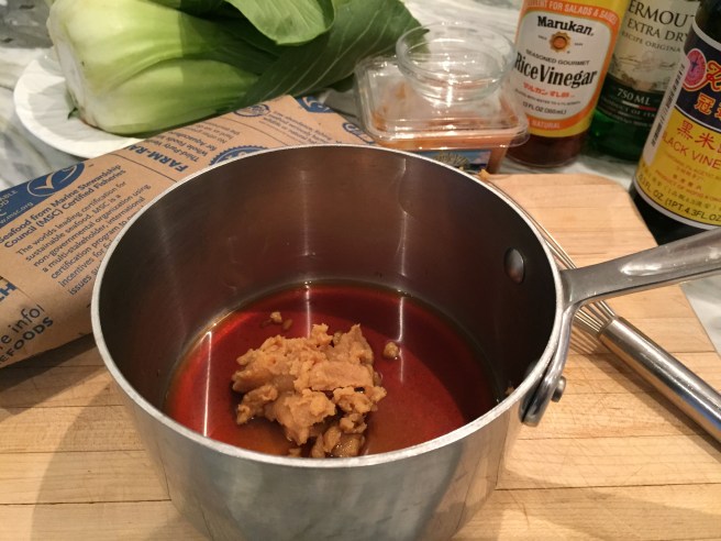 Vermouth, rice vinegar, white miso, sugar, and black vinegar in a small saucepan.