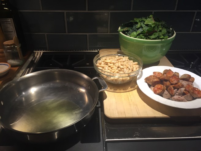 Heating olive oil in large sauté pan