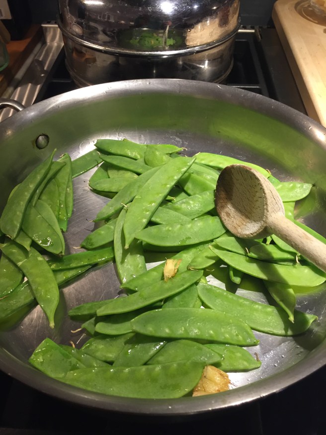 Adding snow peas to skillet