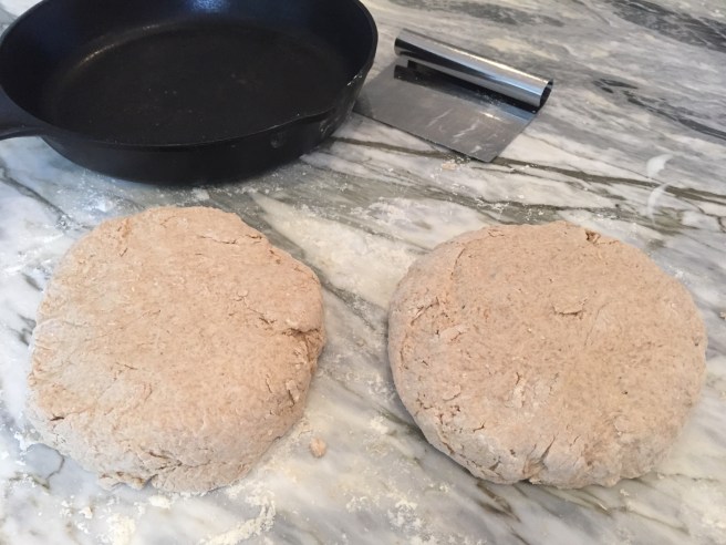 Two loaves of brown soda bread dough